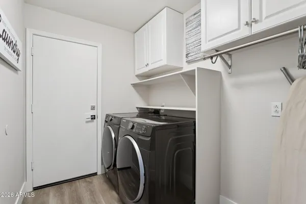 a utility room with dryer and washer
