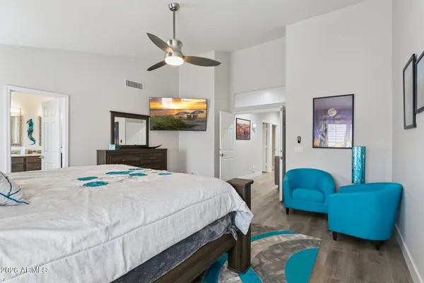 a bedroom with bed and a couch