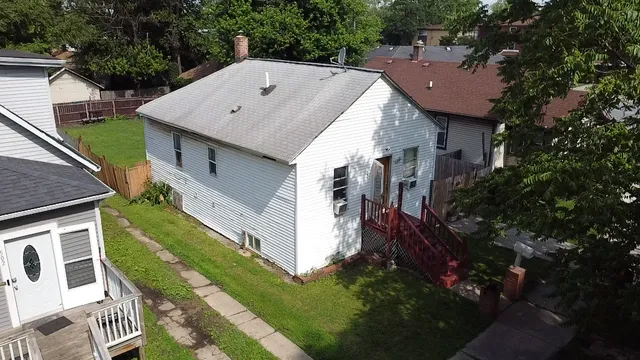 a aerial view of a house with a yard