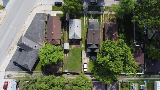 an aerial view of multiple house with outdoor space