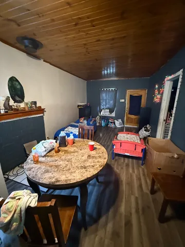 a room with furniture and flat screen tv