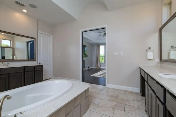 a bathroom with a sink a vanity and a mirror
