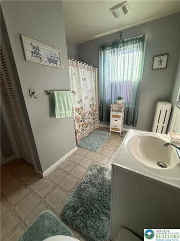 a view of livingroom with furniture and a flat screen tv