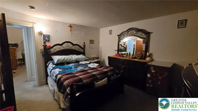 a view of a workspace with furniture and gym equipment