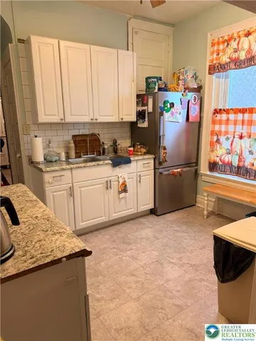 a kitchen with stainless steel appliances a stove and a microwave