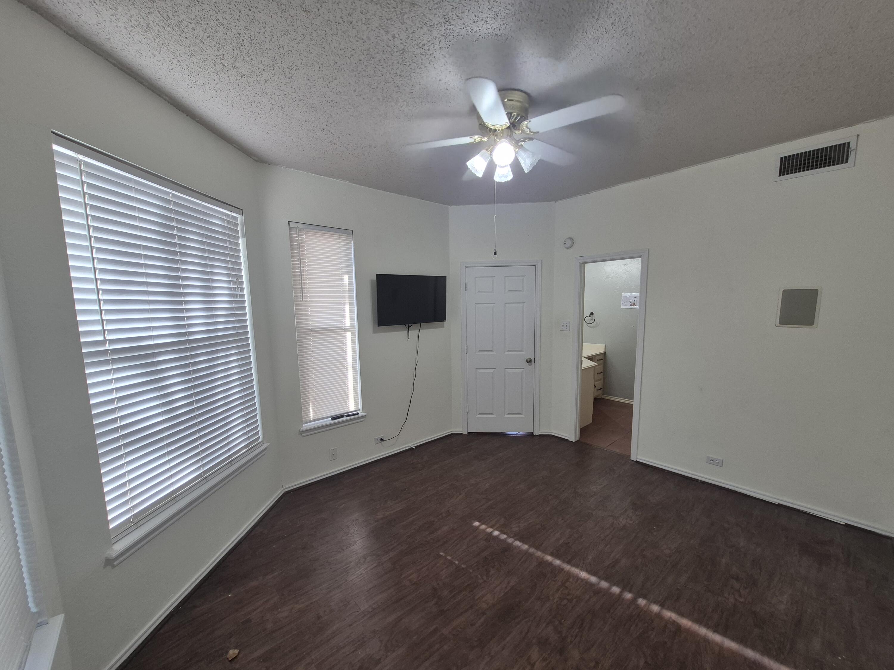 5117 79th Drive Lubbock, TX 79424 - Photo 14 of 35 a view of a livingroom with a ceiling fan and window