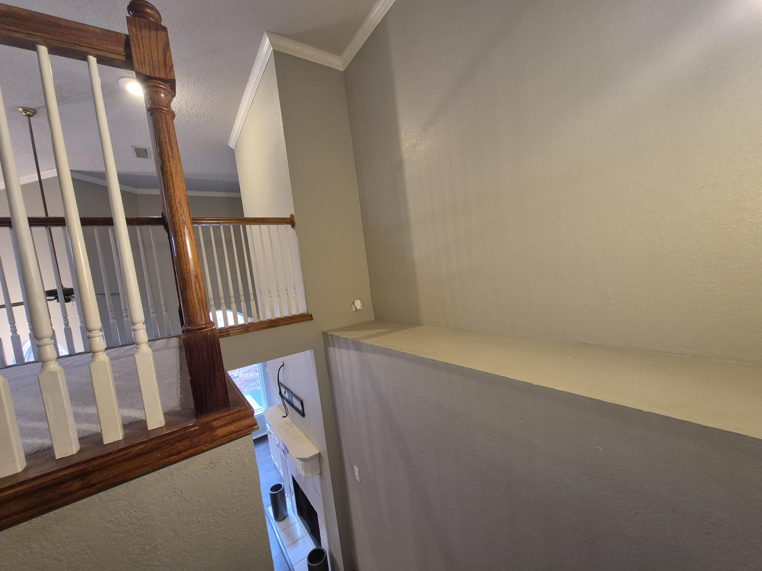 5117 79th Drive Lubbock, TX 79424 - Photo 21 of 35 a view of an entryway with staircase