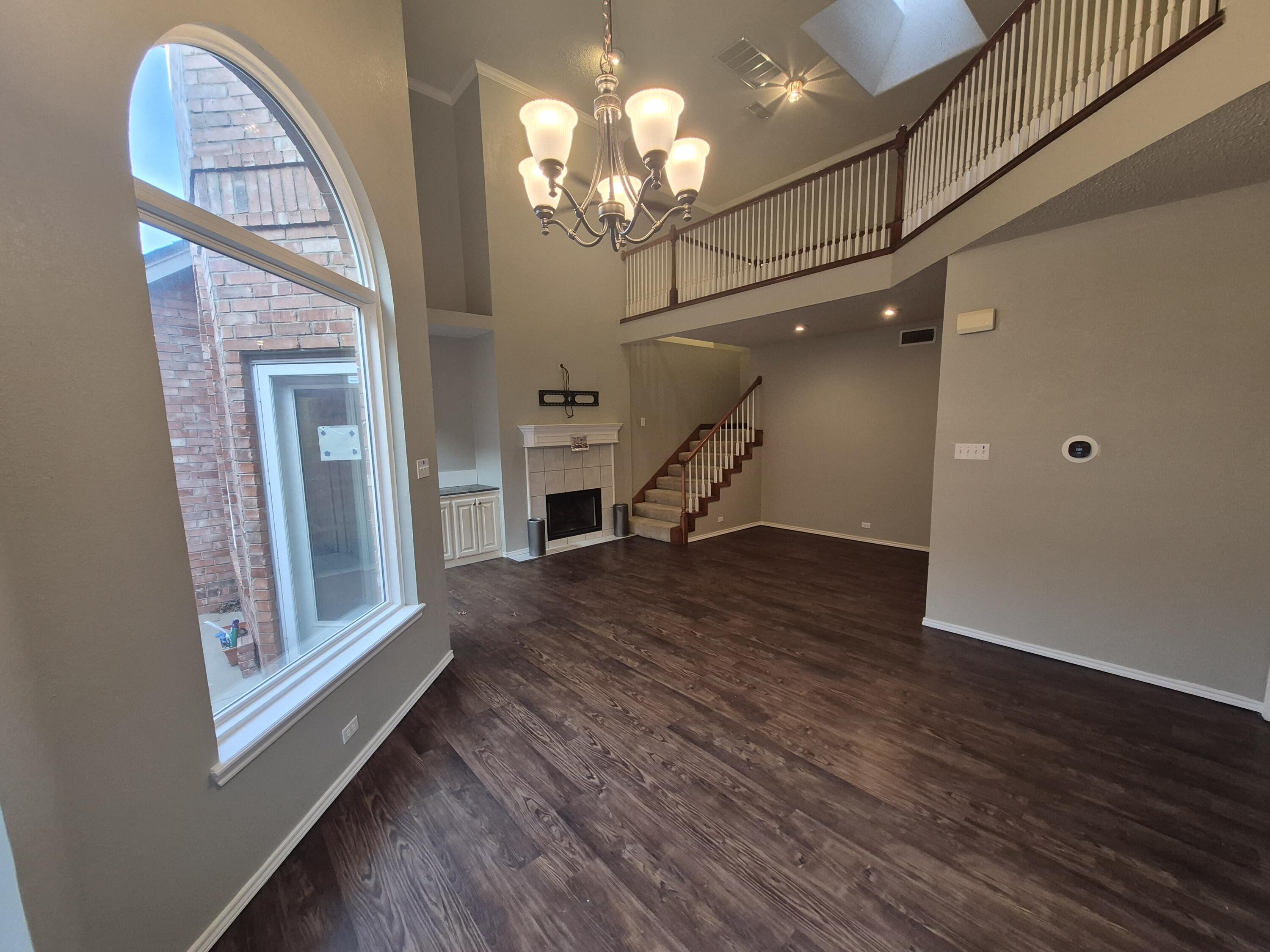 5117 79th Drive Lubbock, TX 79424 - Photo 4 of 35 a view of a livingroom with wooden floor