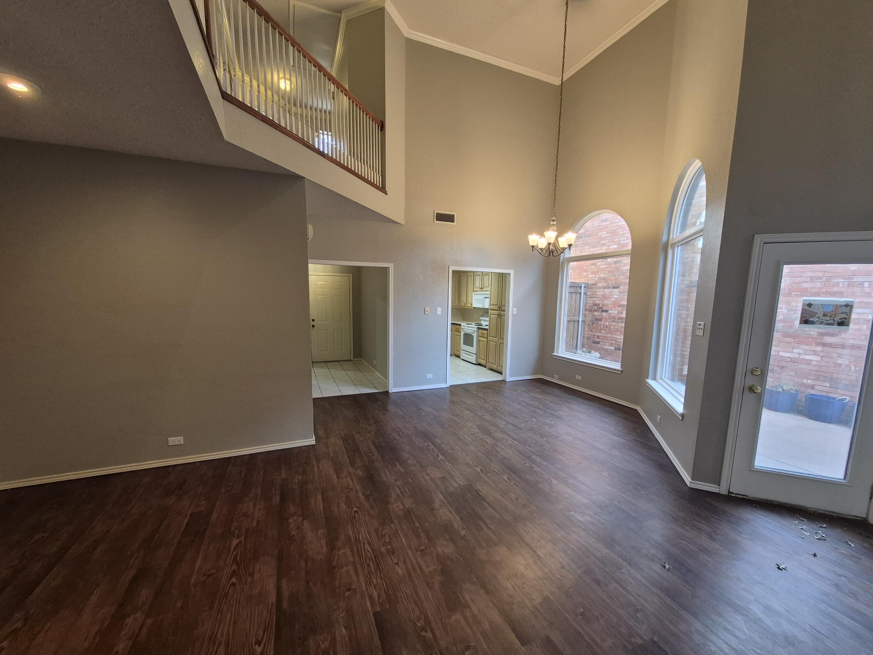 5117 79th Drive Lubbock, TX 79424 - Photo 5 of 35 a view of empty room with wooden floor