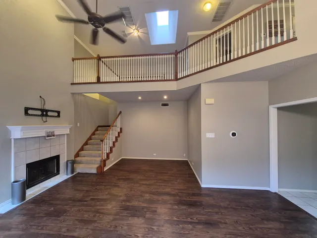 a view of entryway with stairs and wooden floor
