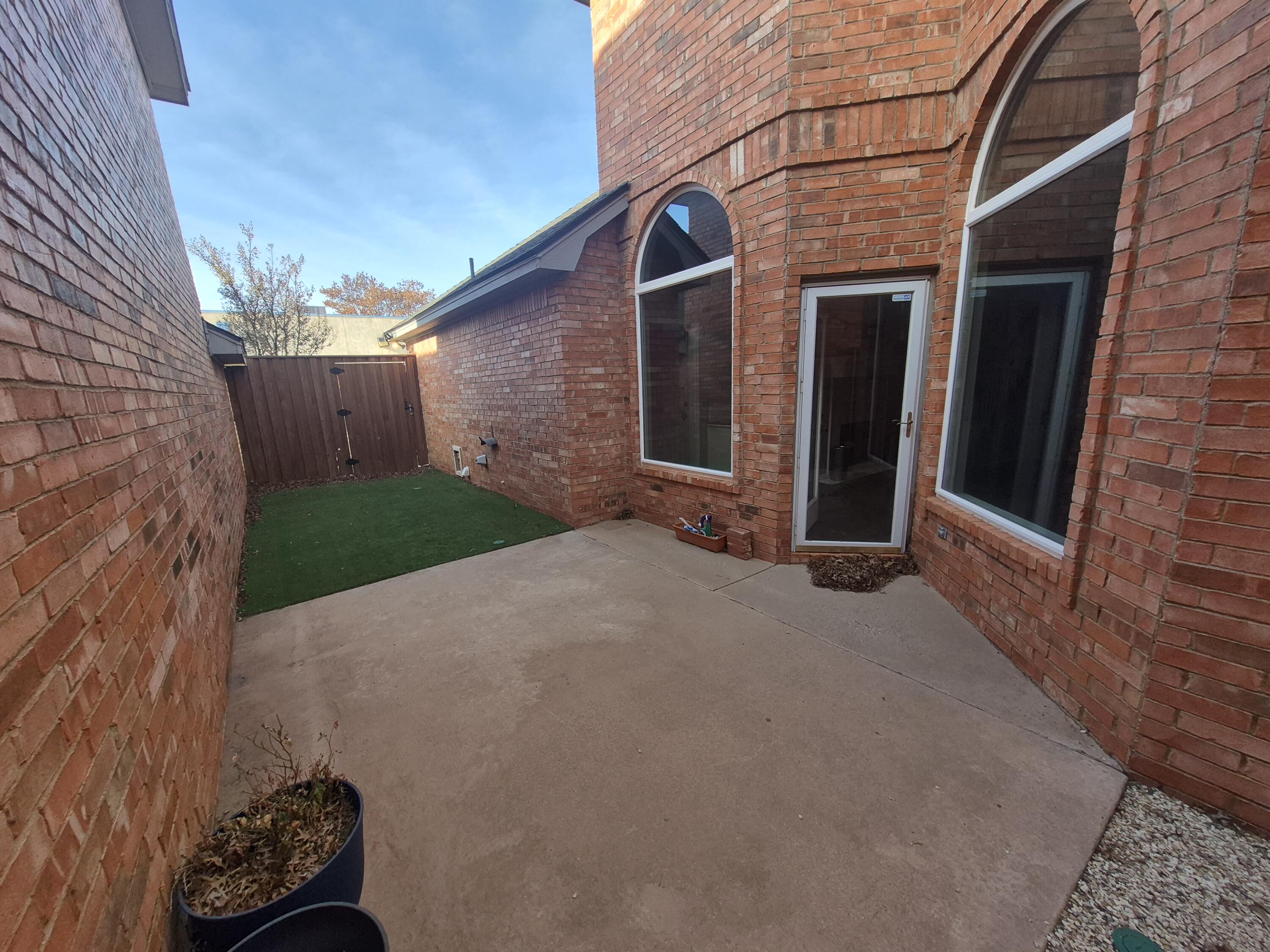 5117 79th Drive Lubbock, TX 79424 - Photo 7 of 35 a backyard of a house with lots of green space