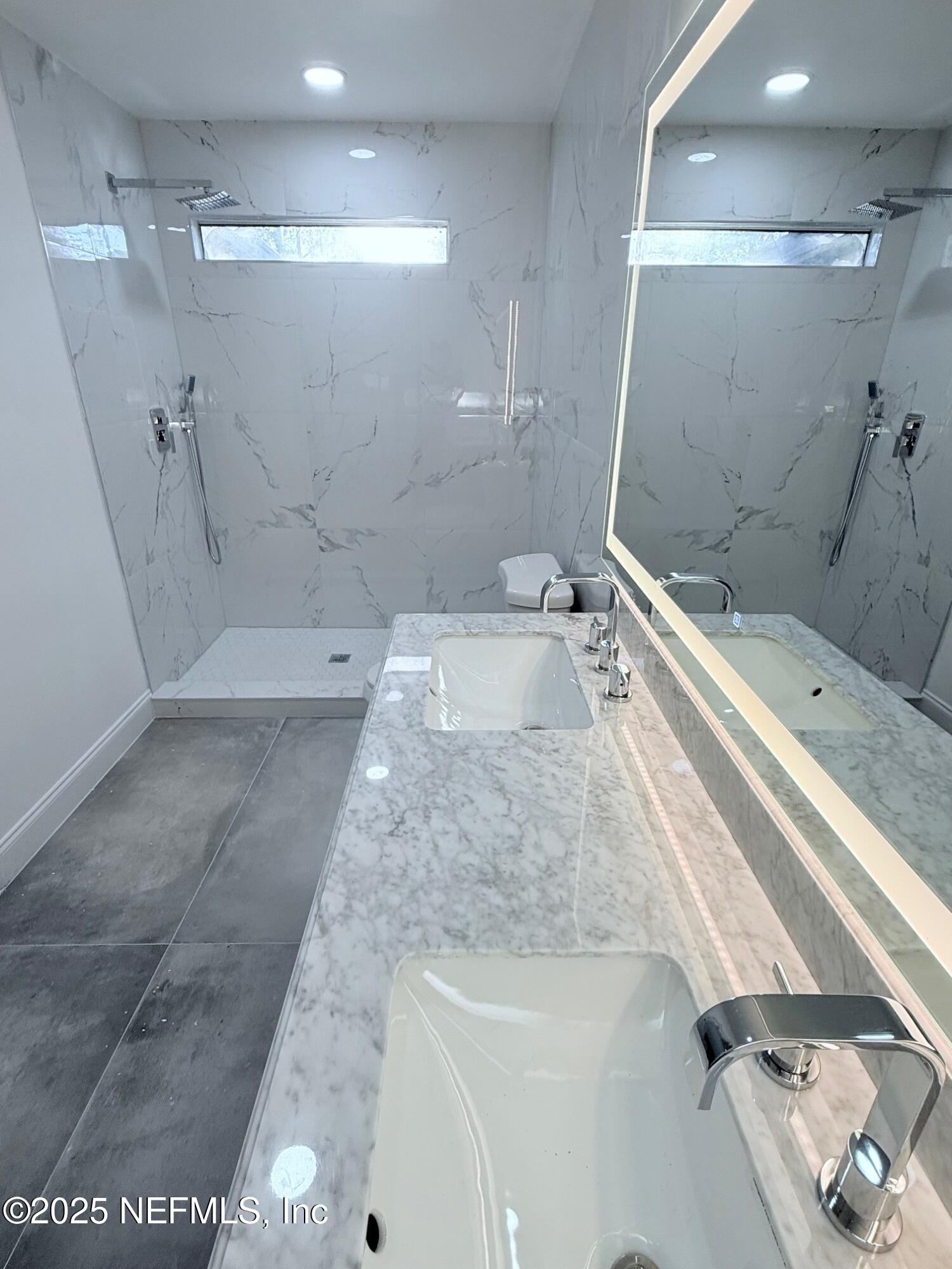 2160 Rothbury Drive Jacksonville, FL 32221 - Photo 12 of 38 a bathroom with a granite countertop sink a toilet and shower