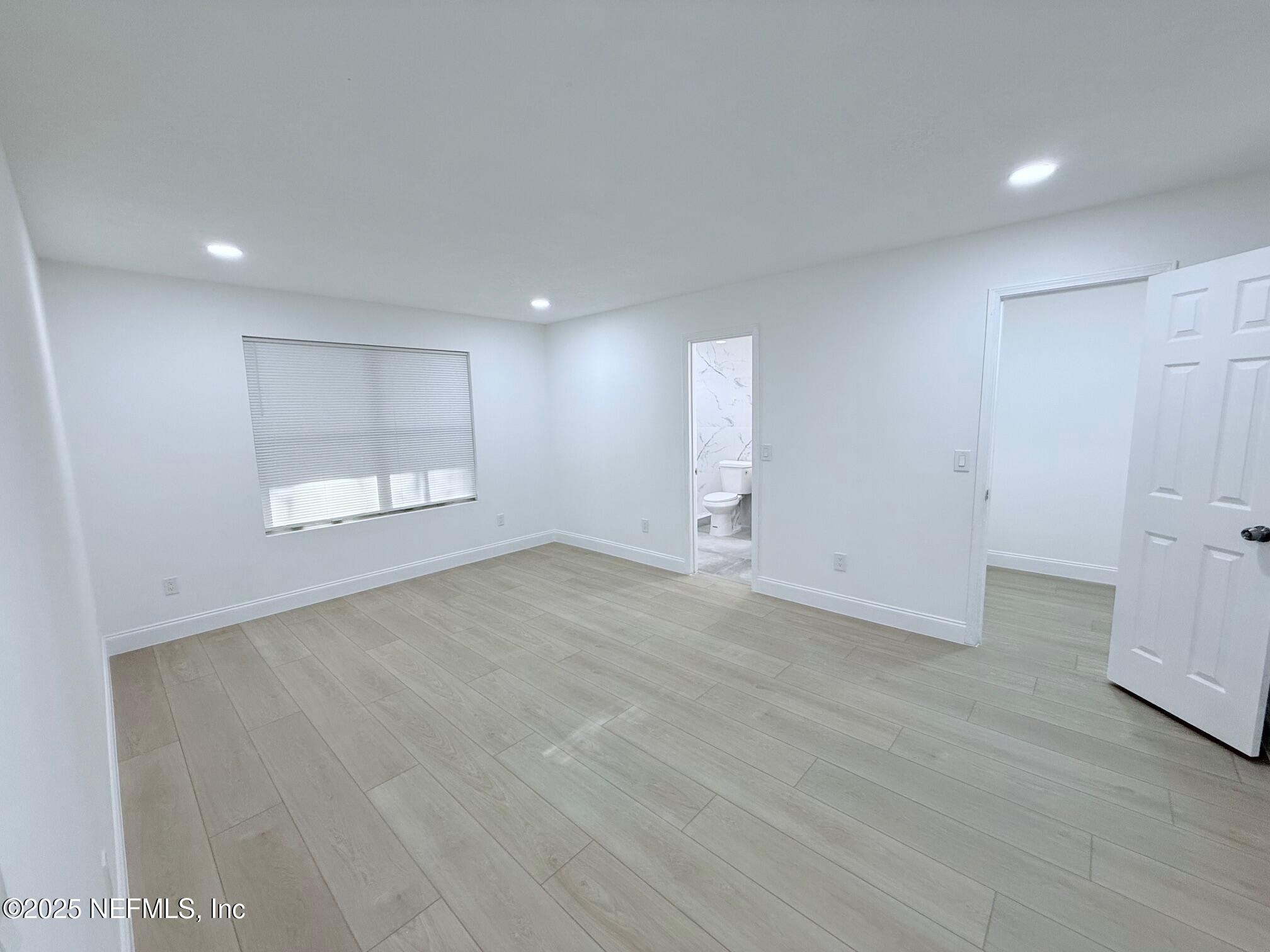 2160 Rothbury Drive Jacksonville, FL 32221 - Photo 19 of 38 an empty room with a empty space and windows