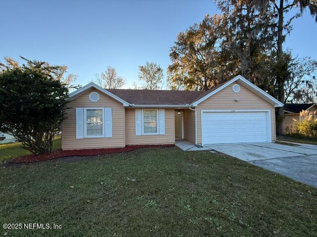 2160 Rothbury Drive Jacksonville, FL 32221 - Photo 38 of 38 a front view of a house with a yard and garage