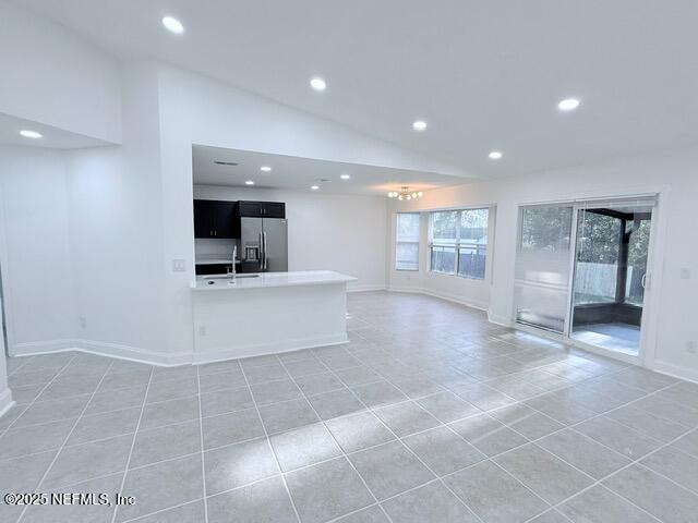 2160 Rothbury Drive Jacksonville, FL 32221 - Photo 5 of 38 a view of an empty room and a kitchen