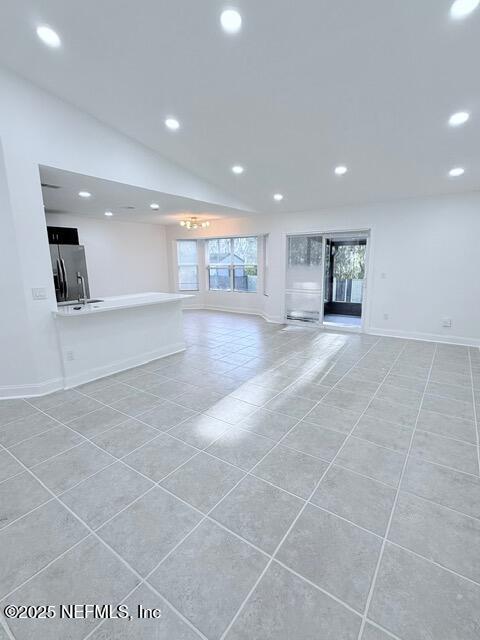 2160 Rothbury Drive Jacksonville, FL 32221 - Photo 6 of 38 a view of an empty room with kitchen and window