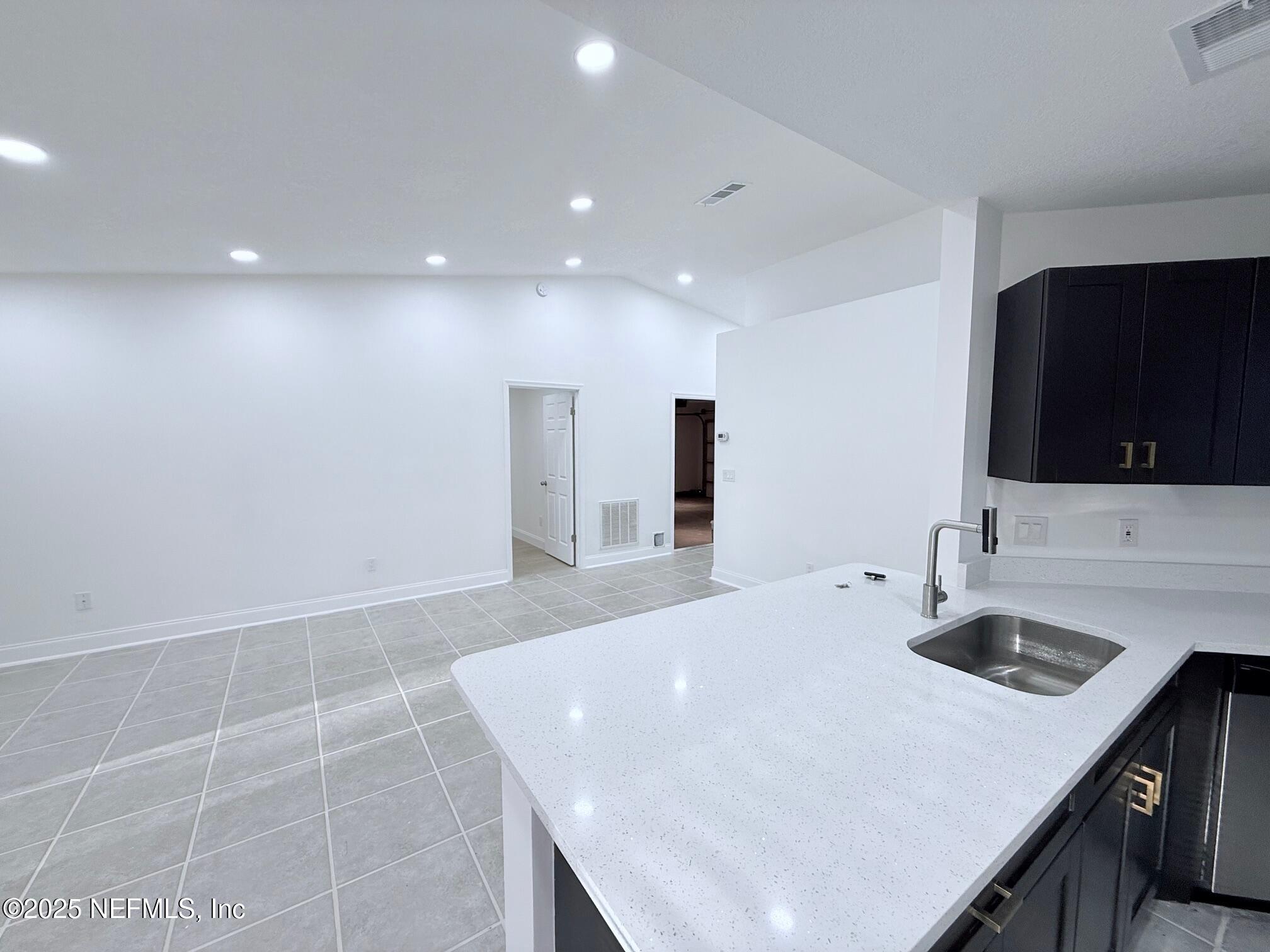 2160 Rothbury Drive Jacksonville, FL 32221 - Photo 7 of 38 a kitchen with a sink a counter space and stainless steel appliances