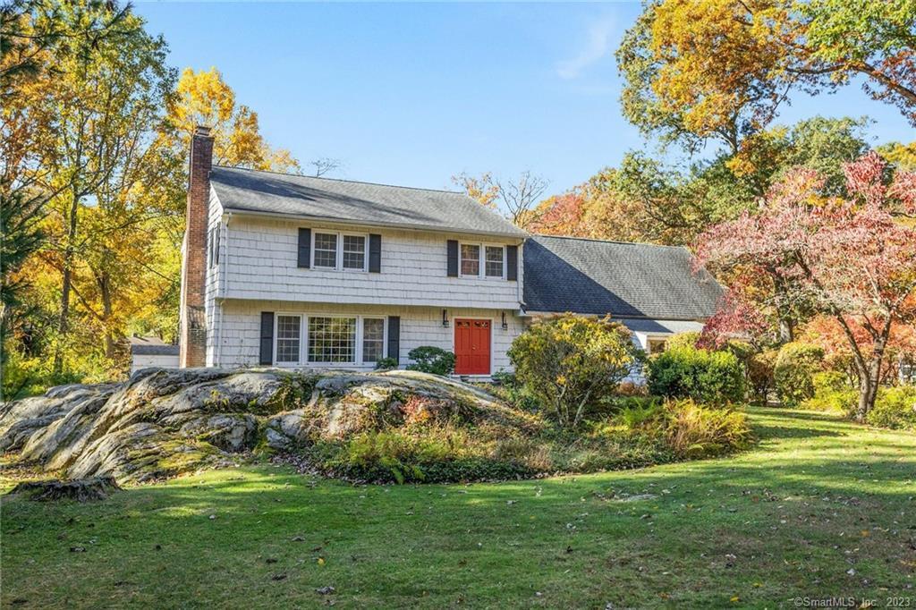 85 Dundee Road Stamford, CT 06903 - Photo 1 of 1 a front view of a house with a garden
