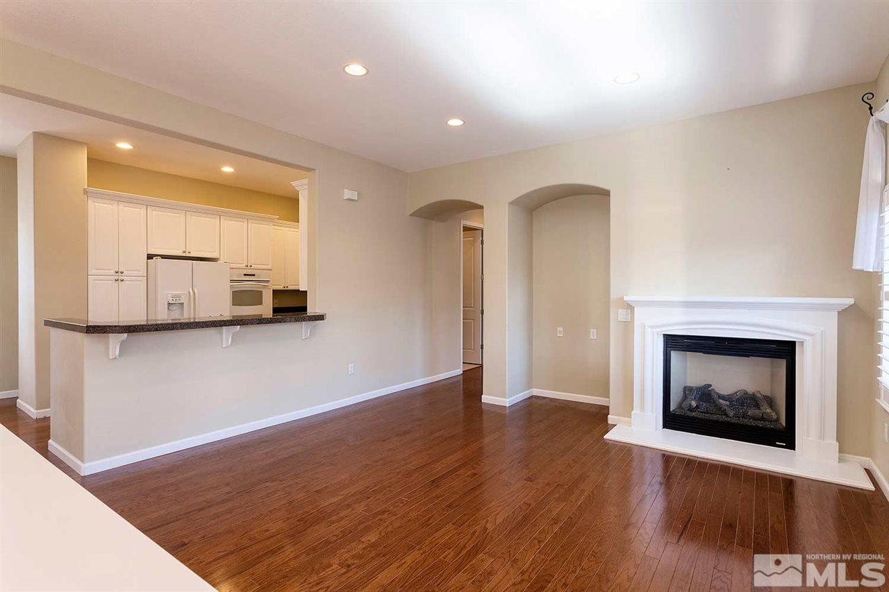 9900 Wilbur May, Unit 3805 Reno, NV 89521 - Photo 5 of 5 a view of an empty room with a fireplace and a window