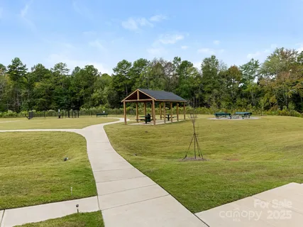 a view of swimming pool with a big yard