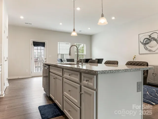 a bathroom with double vanity and a mirror