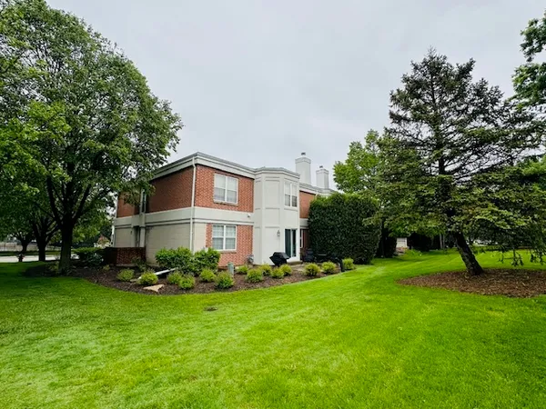 a view of a house with a back yard