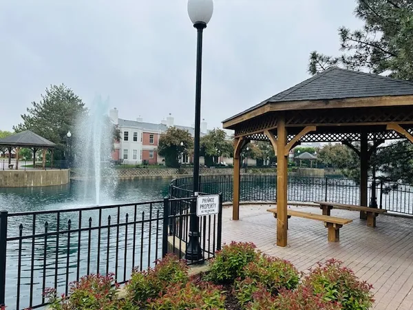 a view of a swimming pool with a patio and a garden