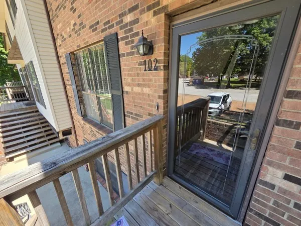 a view of a balcony with wooden floor