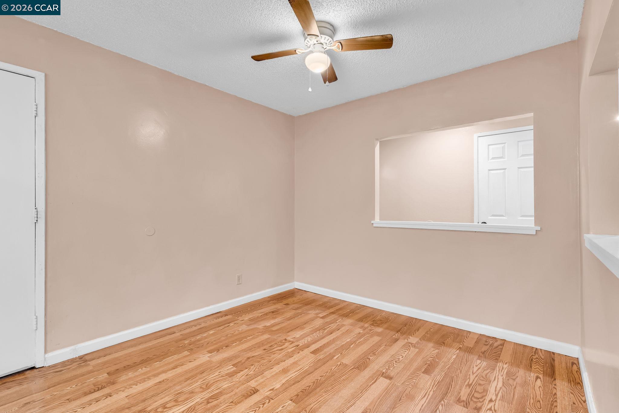3321 Fraser Road Antioch, CA 94509 - Photo 11 of 46 an empty room with a window and a ceiling fan