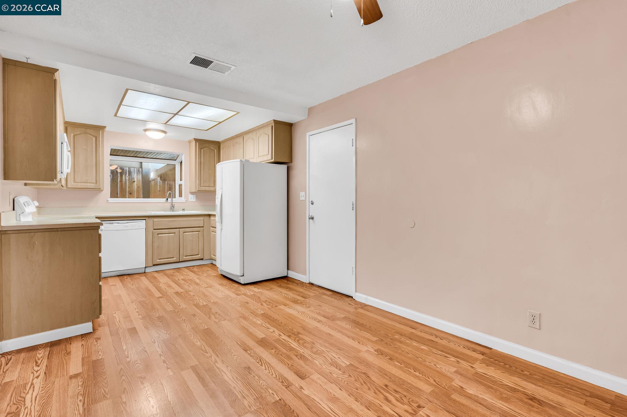 3321 Fraser Road Antioch, CA 94509 - Photo 12 of 46 a view of a kitchen with wooden floor and a kitchen