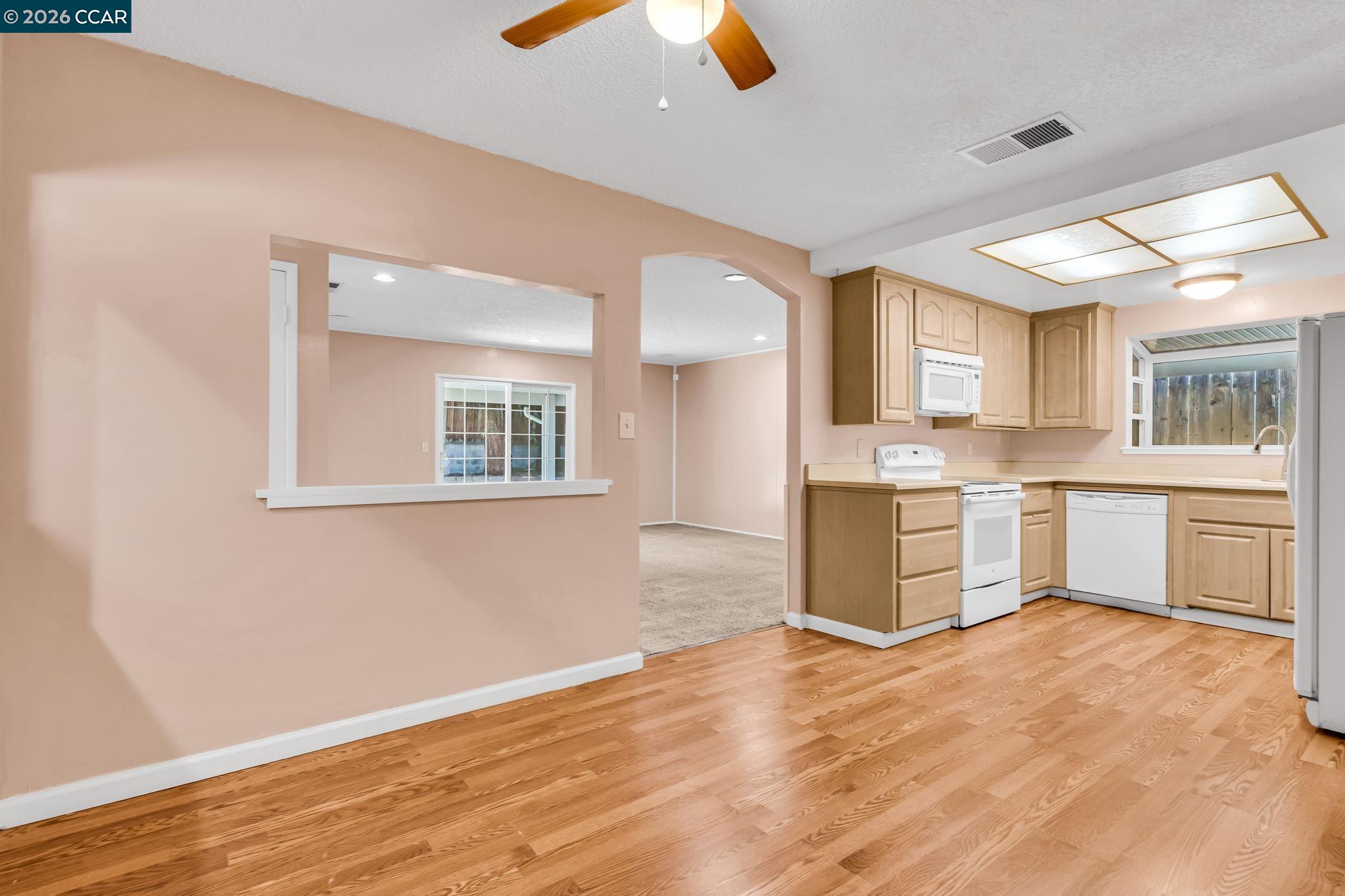 3321 Fraser Road Antioch, CA 94509 - Photo 14 of 46 a view of a kitchen with wooden floor and a window