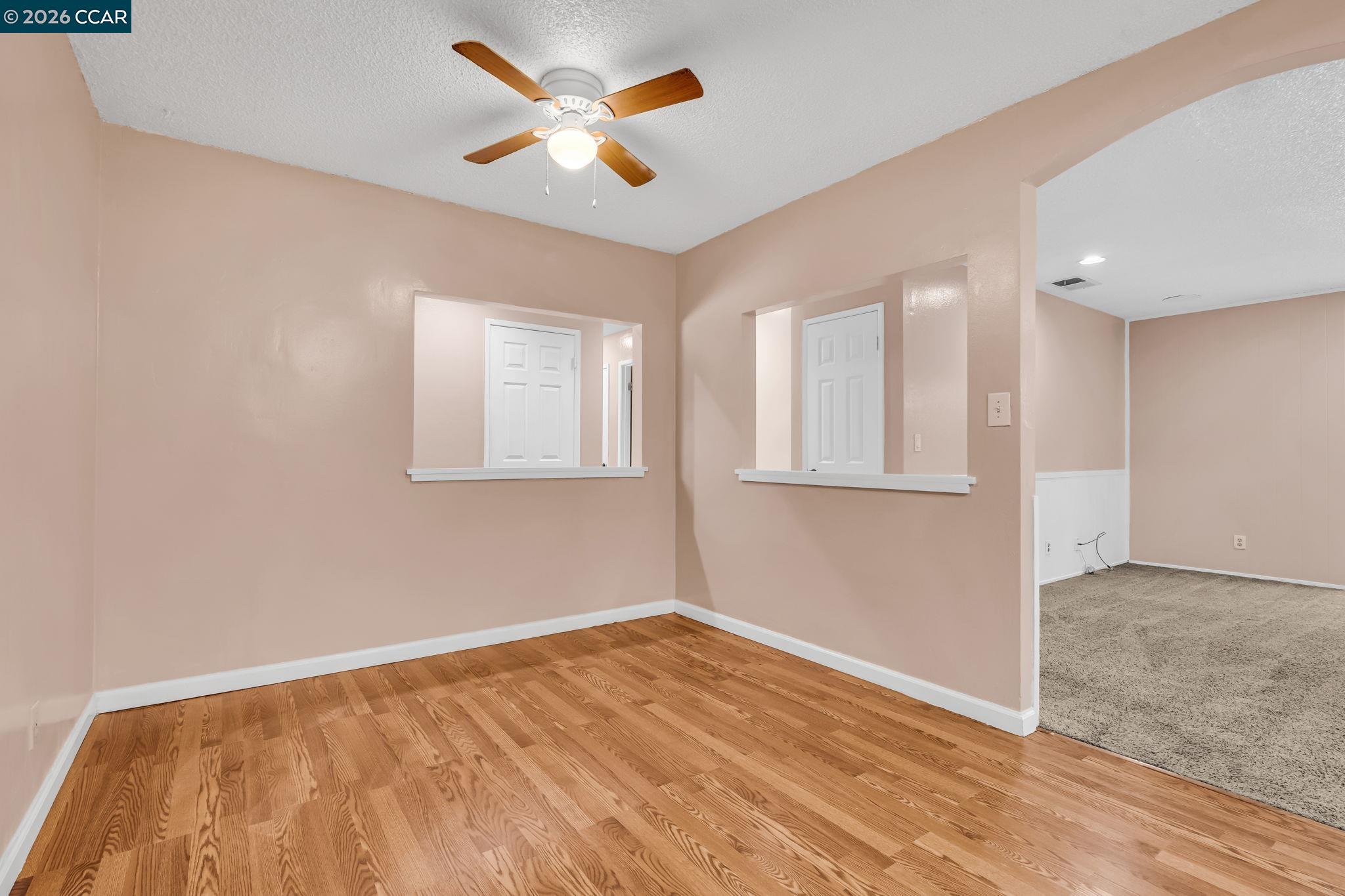 3321 Fraser Road Antioch, CA 94509 - Photo 15 of 46 an empty room with wooden floor and windows