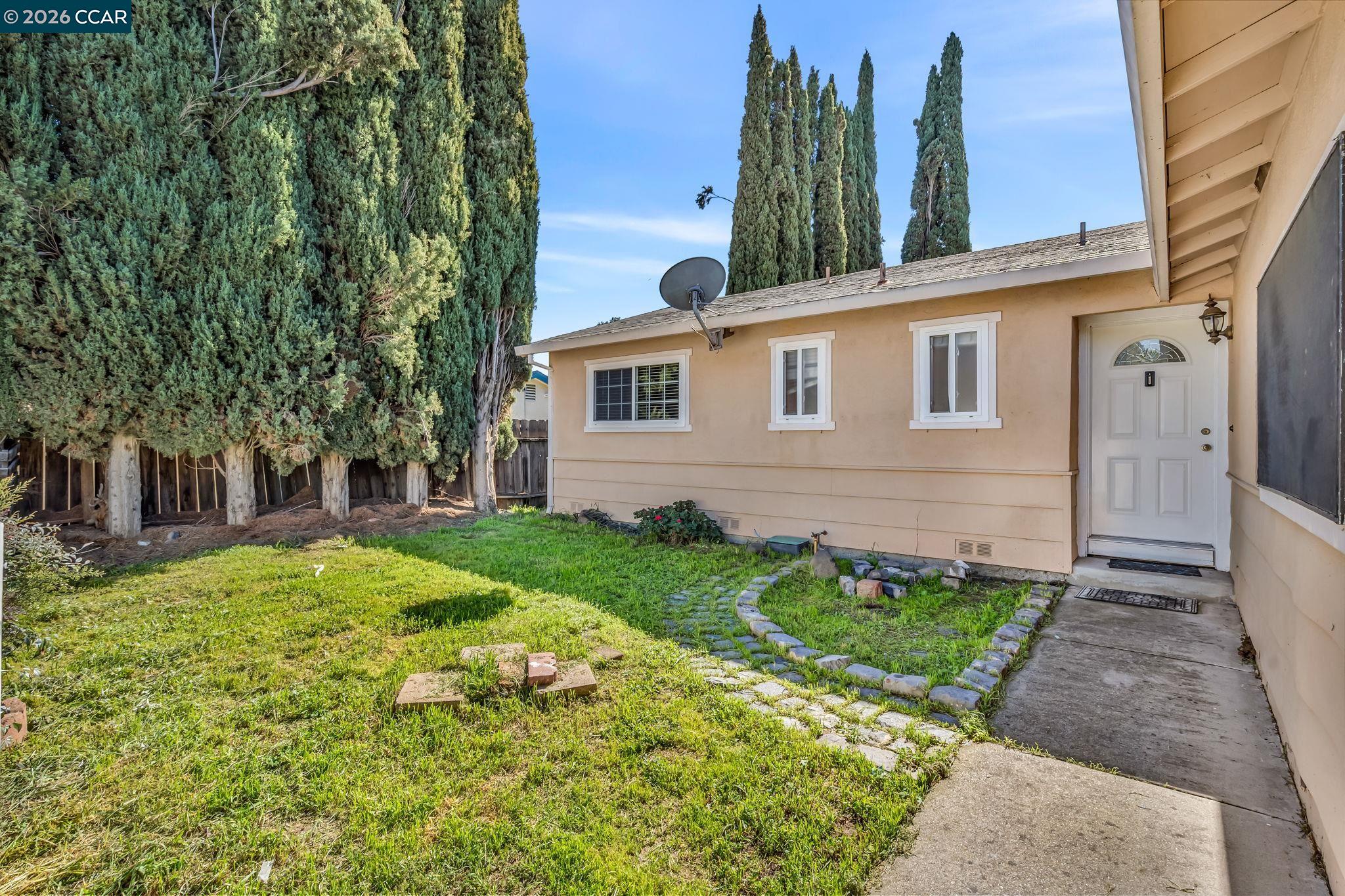 3321 Fraser Road Antioch, CA 94509 - Photo 3 of 46 a front view of a house with garden