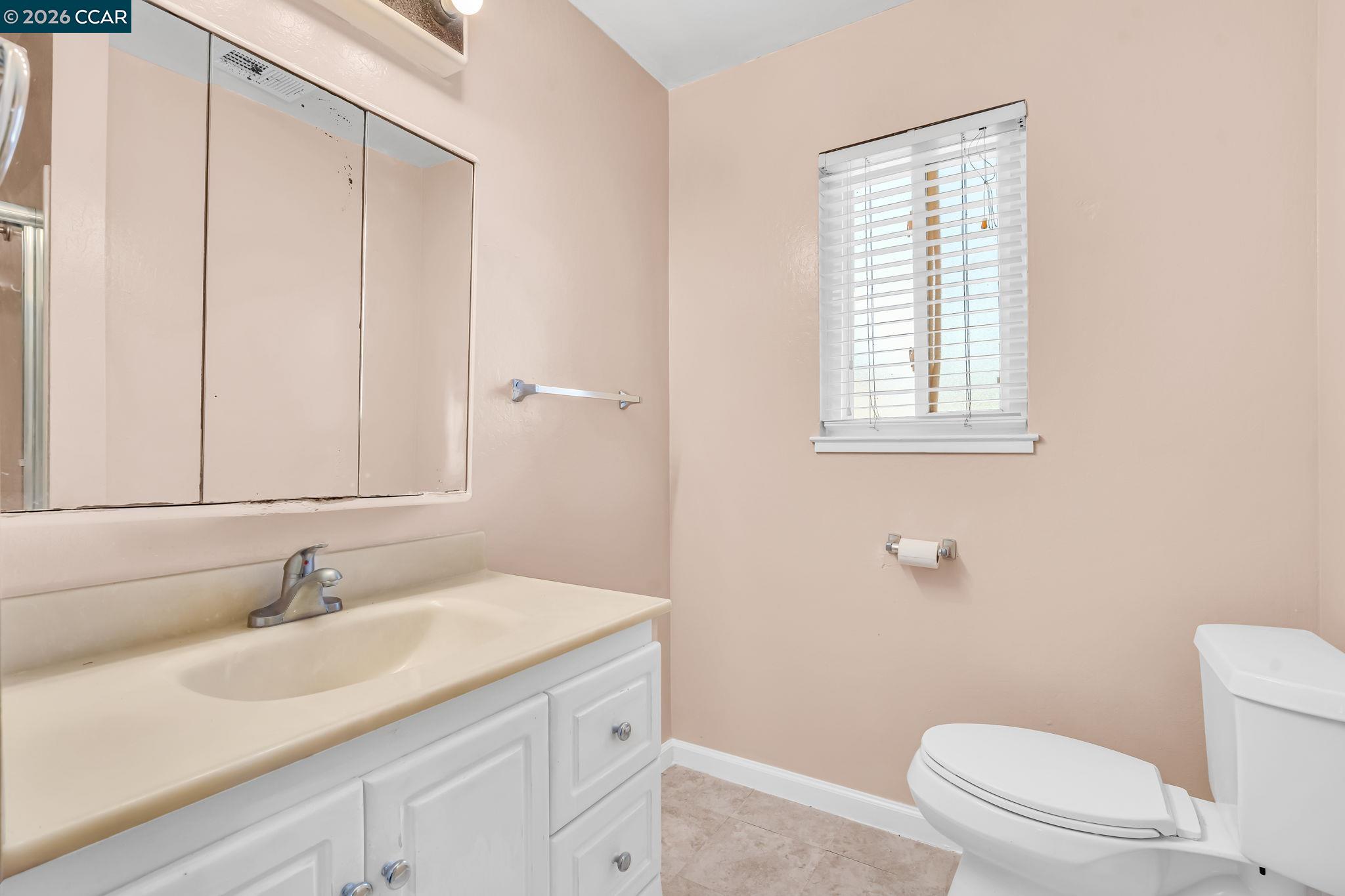 3321 Fraser Road Antioch, CA 94509 - Photo 31 of 46 a bathroom with a sink toilet and vanity