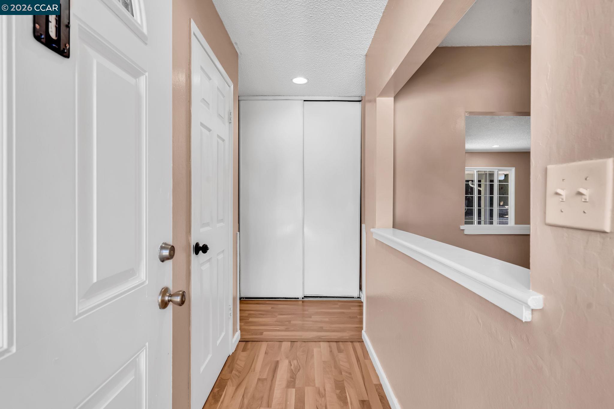 3321 Fraser Road Antioch, CA 94509 - Photo 5 of 46 a view of a hallway with wooden floor and staircase