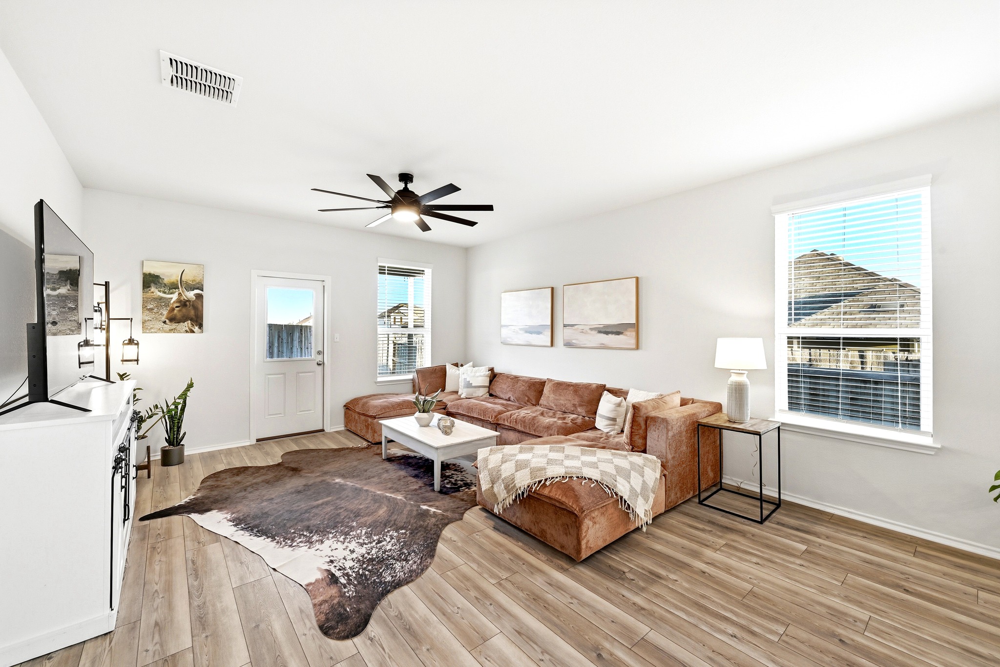 462 Tree Nut Loop Buda, TX 78610 - Photo 11 of 38 Windows along the back wall bring in steady natural light and provide a direct view of the backyard