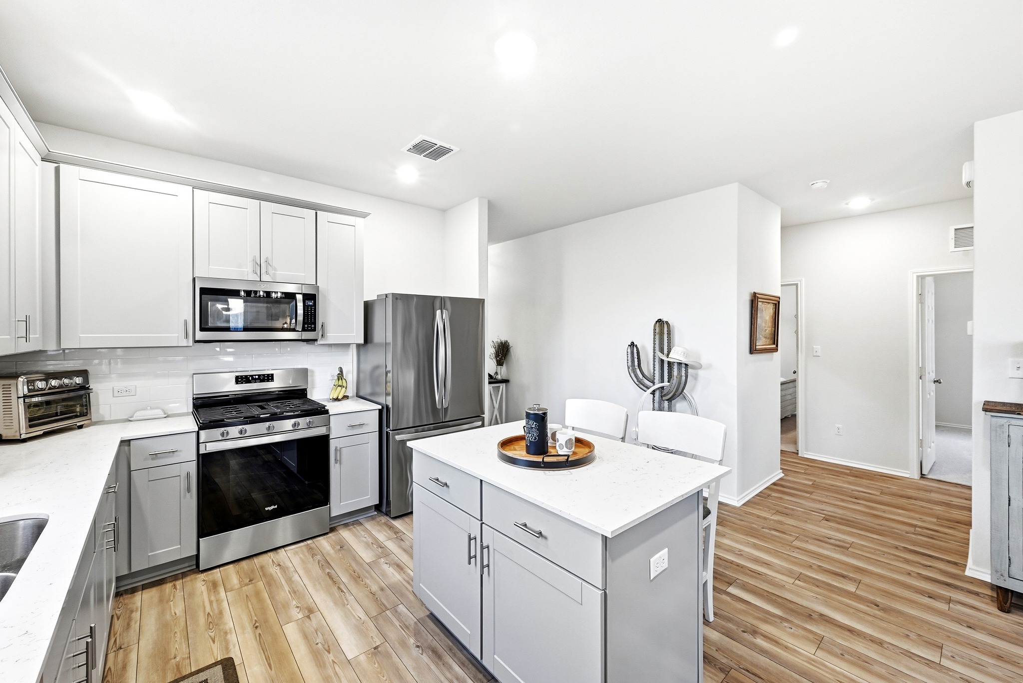 462 Tree Nut Loop Buda, TX 78610 - Photo 15 of 38 Upper and lower cabinetry provides plenty of storage to keep the counters clear of small appliances