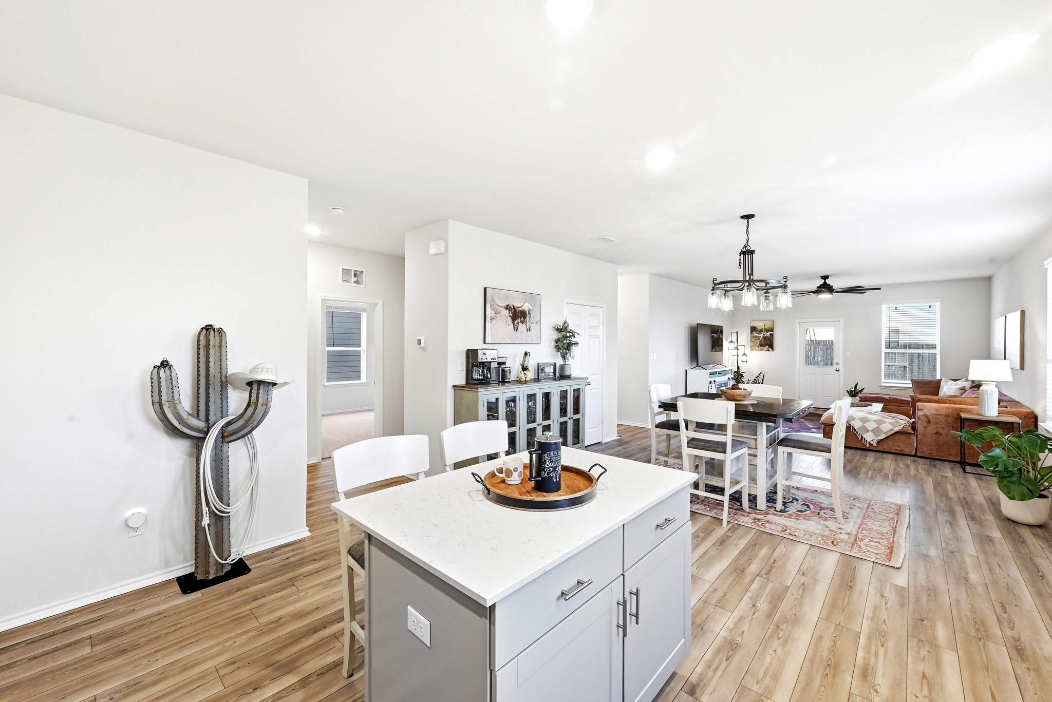 462 Tree Nut Loop Buda, TX 78610 - Photo 16 of 38 The island overhang accommodates barstools, making it a practical spot for quick meals or a laptop