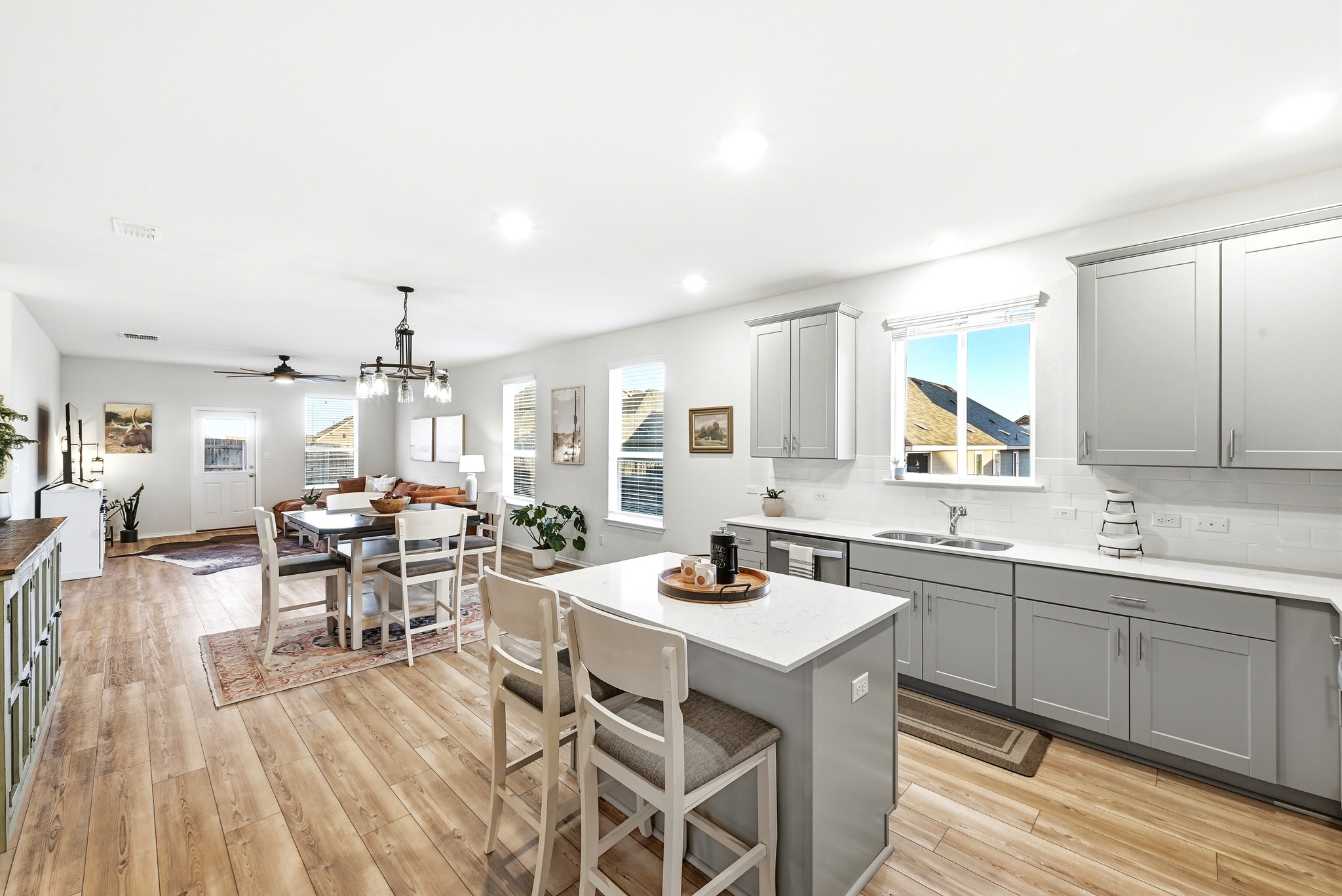 462 Tree Nut Loop Buda, TX 78610 - Photo 17 of 38 Having the main kitchen island and prep space just steps away makes it incredibly easy to move from cooking to a full dinner setup without any back-and-forth through the rest of the home