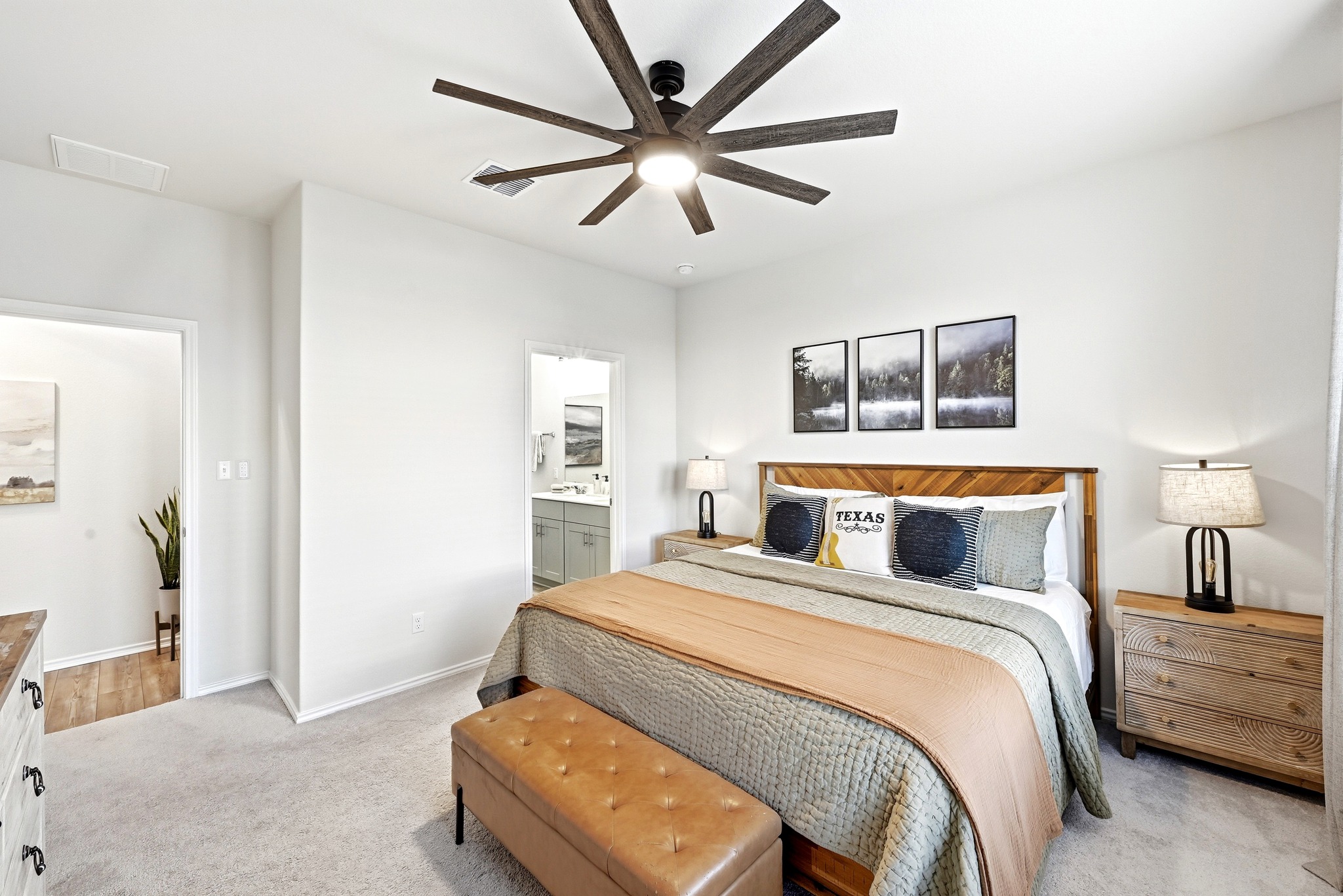 462 Tree Nut Loop Buda, TX 78610 - Photo 18 of 38 Natural light from the backyard windows makes the primary suite feel bright and open