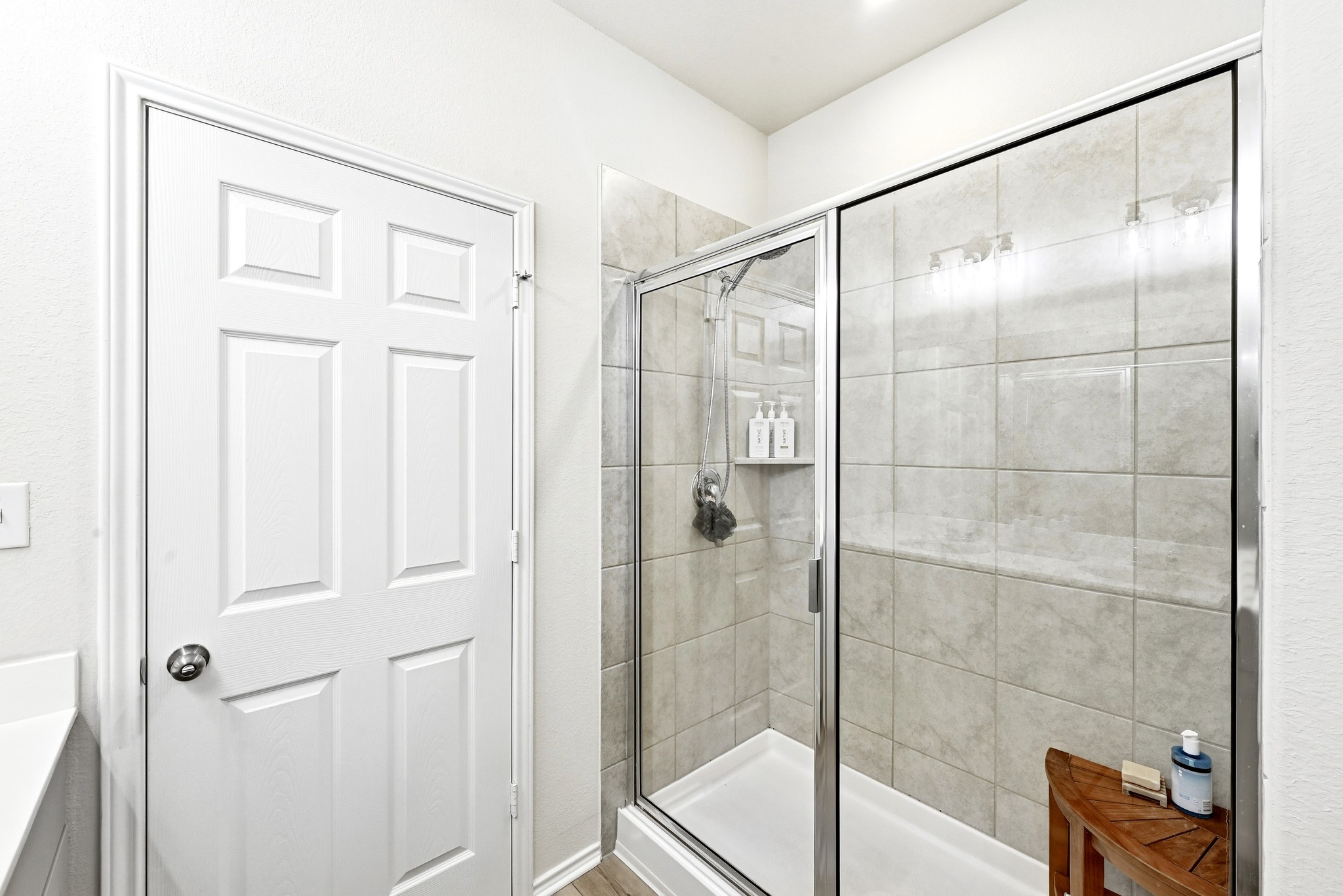 462 Tree Nut Loop Buda, TX 78610 - Photo 20 of 38 A large step-in shower with tile surrounds offers a relaxing space to begin or end your day