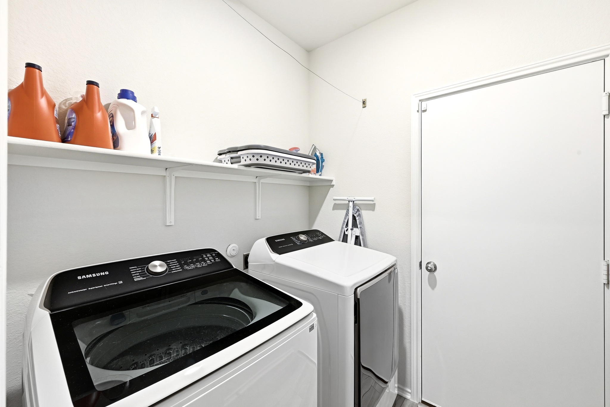 462 Tree Nut Loop Buda, TX 78610 - Photo 24 of 38 The laundry room offers direct access to the 2 car garage