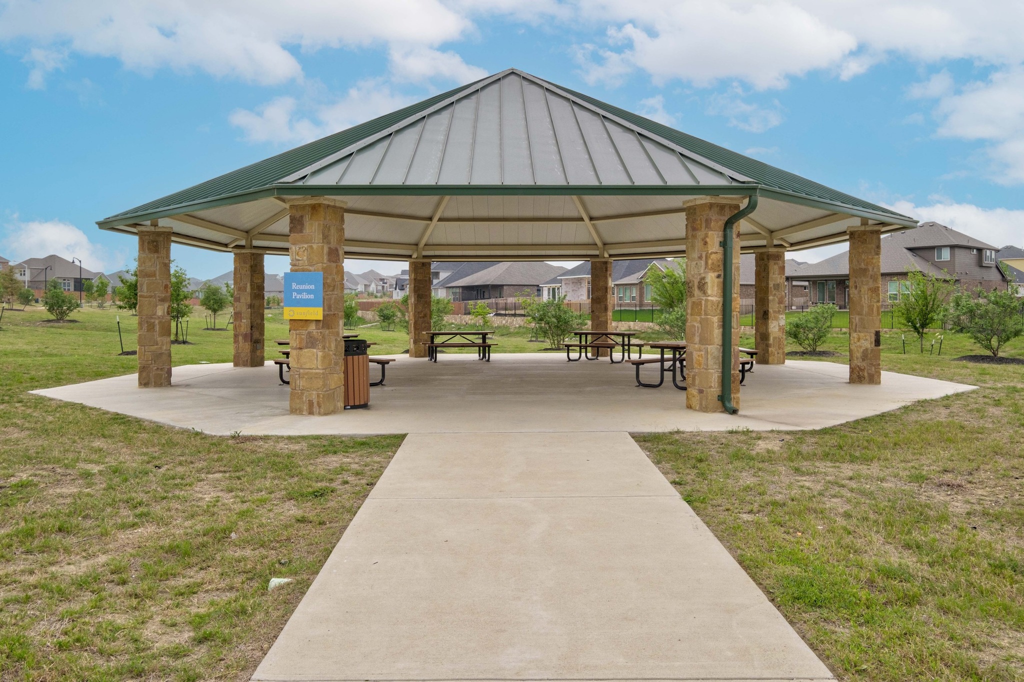 462 Tree Nut Loop Buda, TX 78610 - Photo 26 of 38 The stone pavilion provides a shaded outdoor landmark for picnics and neighborhood markets in Sunfield