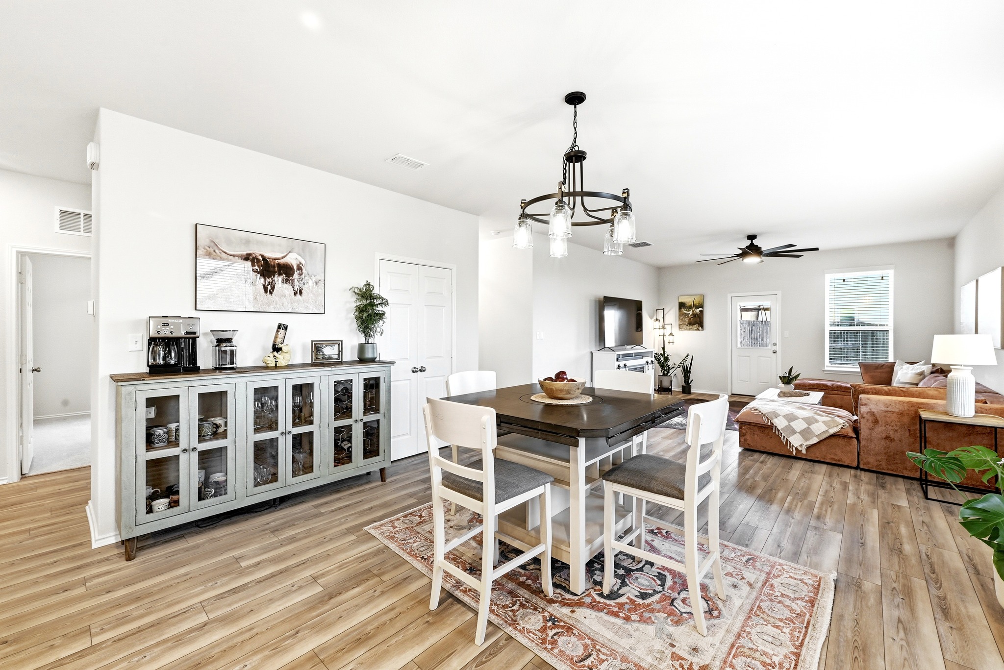 462 Tree Nut Loop Buda, TX 78610 - Photo 3 of 38 The dining area is centrally located, providing a dedicated spot for meals between the kitchen and living room