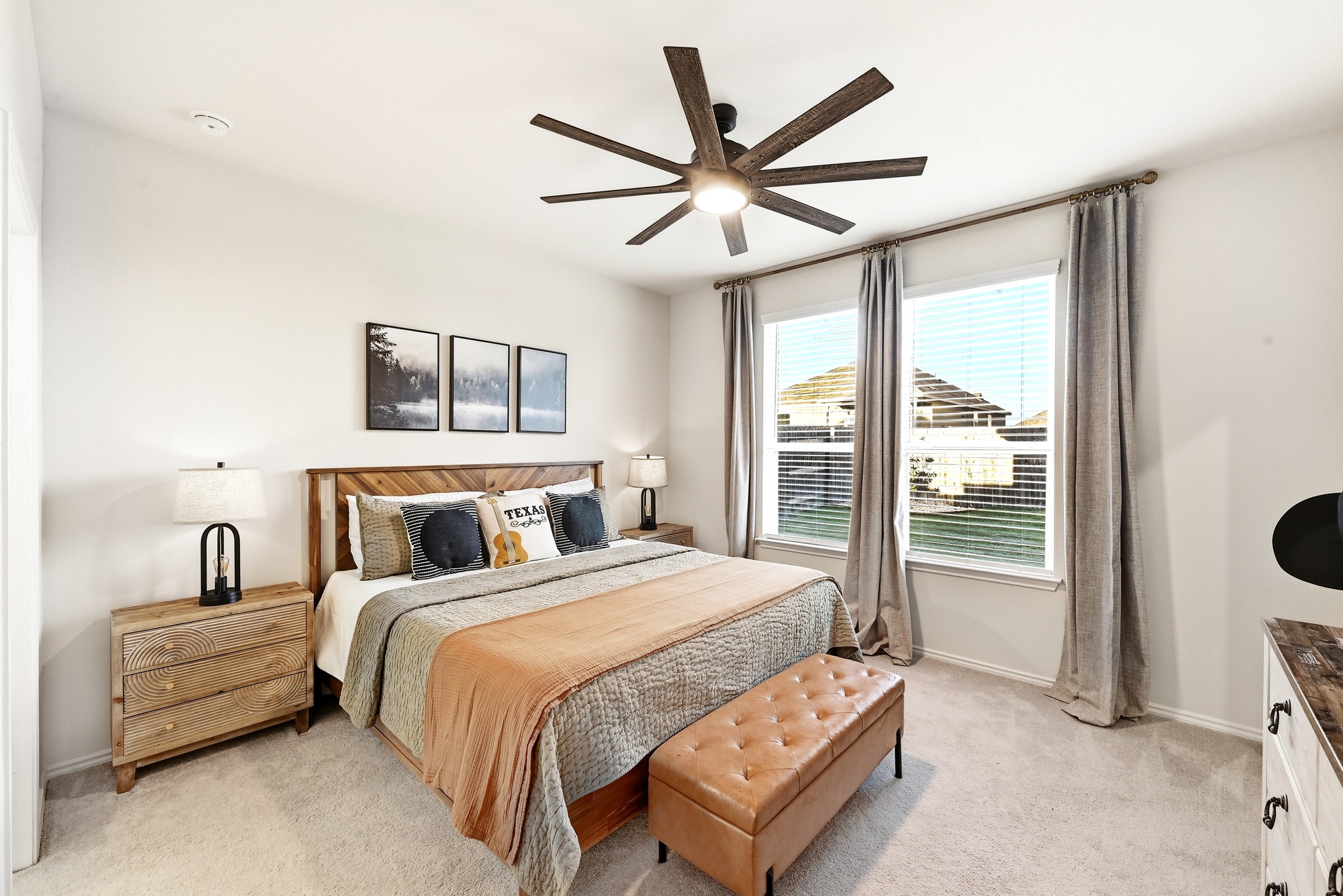 462 Tree Nut Loop Buda, TX 78610 - Photo 5 of 38 The primary bedroom is set at the back of the house for privacy and fits a king-sized furniture set