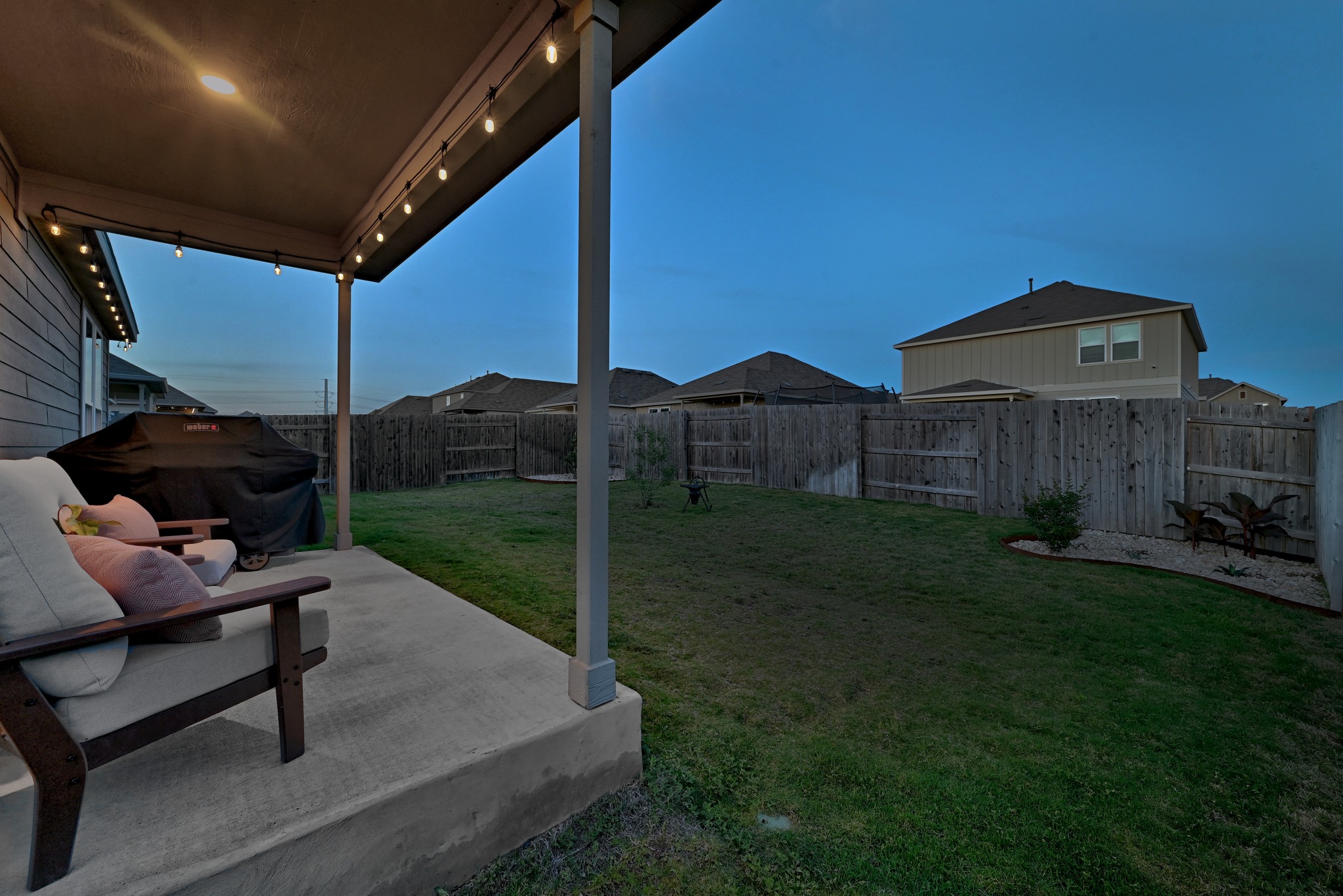 462 Tree Nut Loop Buda, TX 78610 - Photo 6 of 38 The covered back patio provides a shaded outdoor area for grilling or relaxing out of the sun