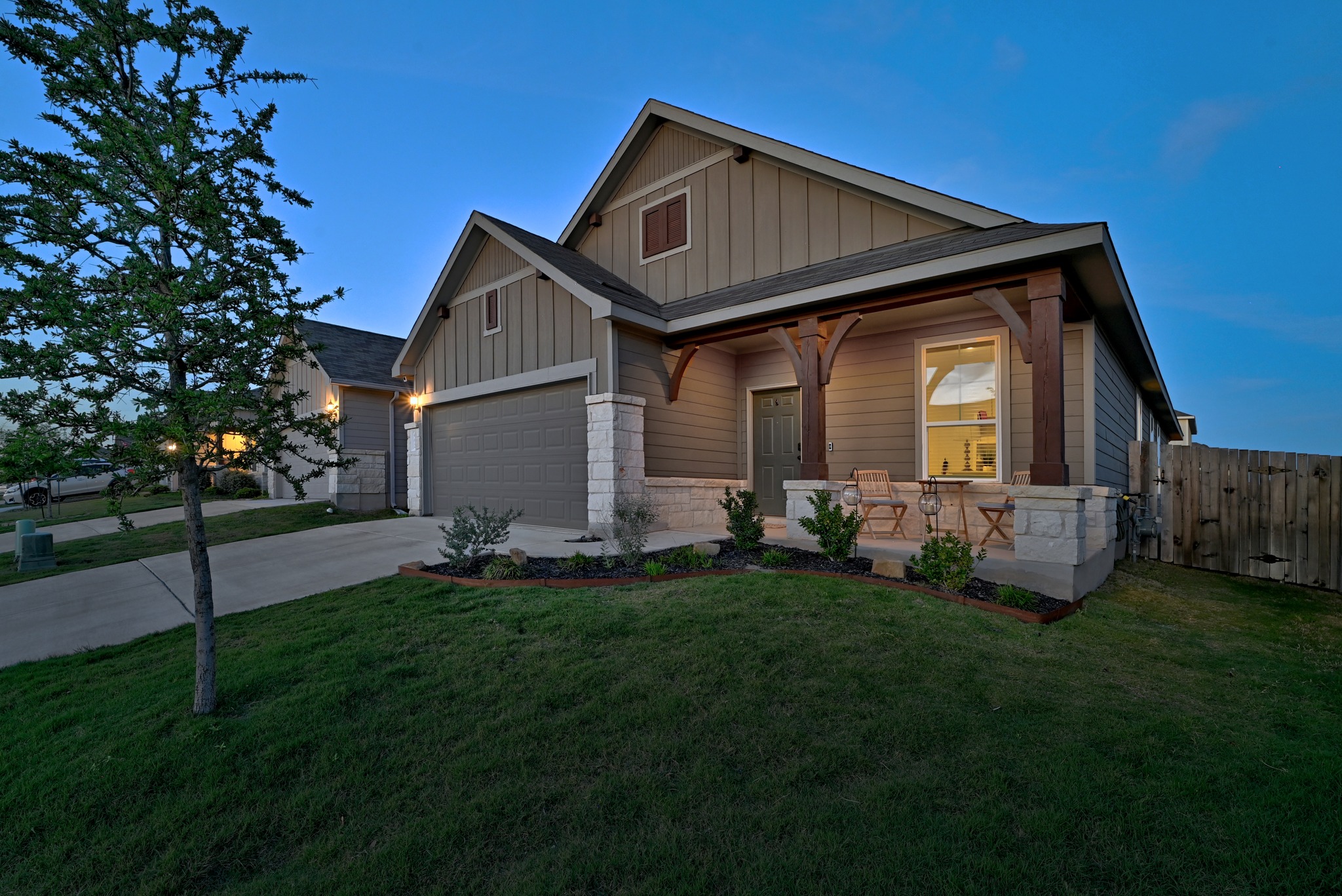 462 Tree Nut Loop Buda, TX 78610 - Photo 7 of 38 A driveway and a two-car garage provide plenty of space for vehicles and gear in this Sunfield neighborhood