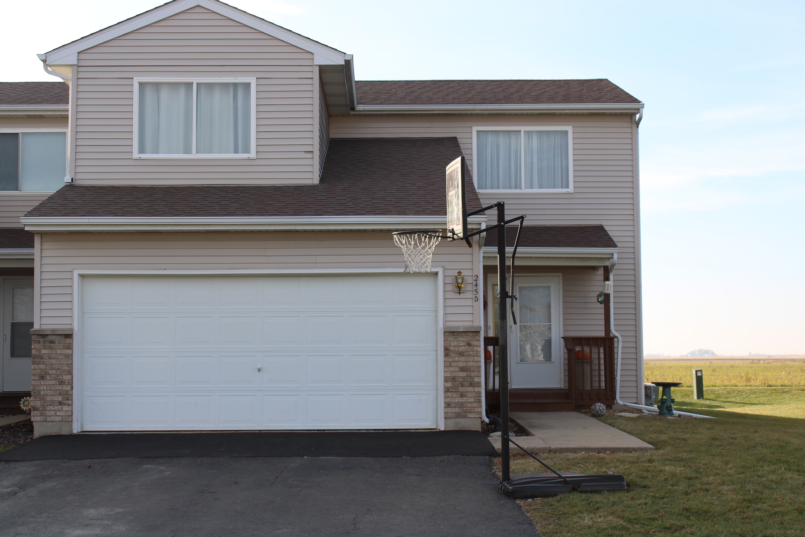 245 Rollin Road, Unit D Somonauk, IL 60552 - Photo 1 of 29 a house view with a outdoor space