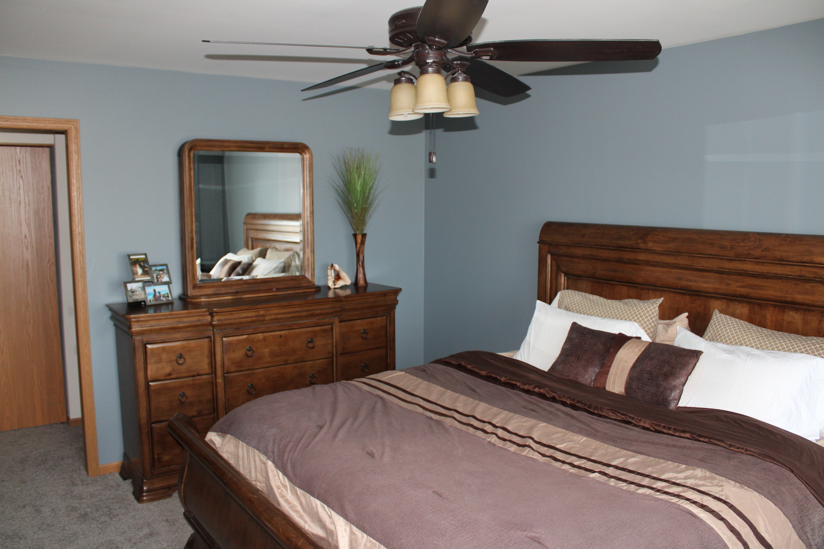 245 Rollin Road, Unit D Somonauk, IL 60552 - Photo 14 of 29 a bedroom with a bed and a dresser