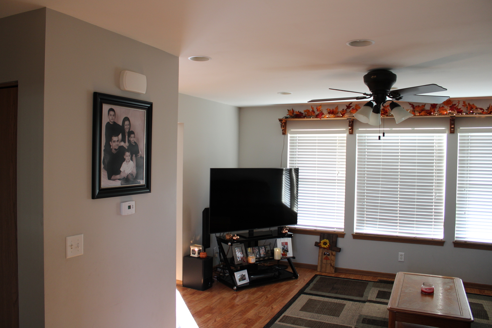245 Rollin Road, Unit D Somonauk, IL 60552 - Photo 3 of 29 a living room with furniture and a flat screen tv